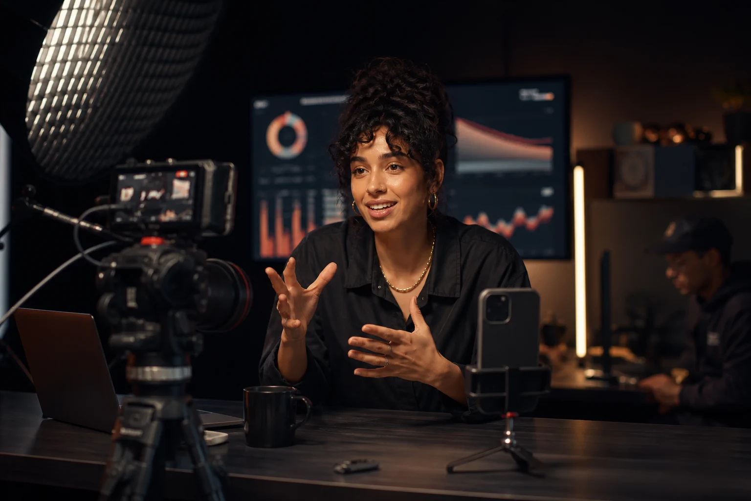 A creator producing content in a professional studio with production equipment and growth insights